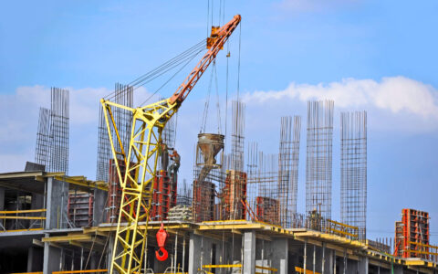 Crane lifting cement mixing container